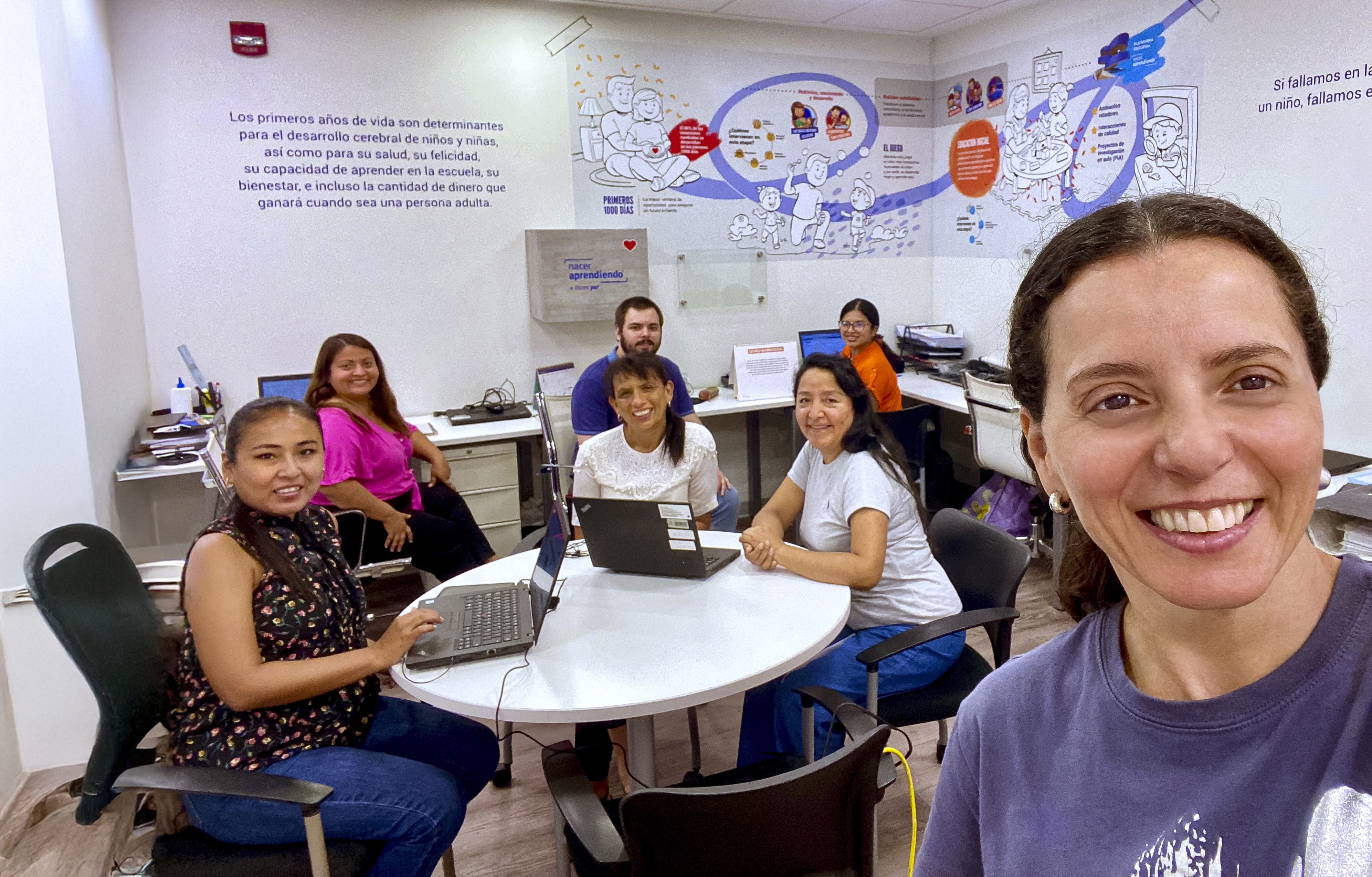 Two people working outside celebrate
