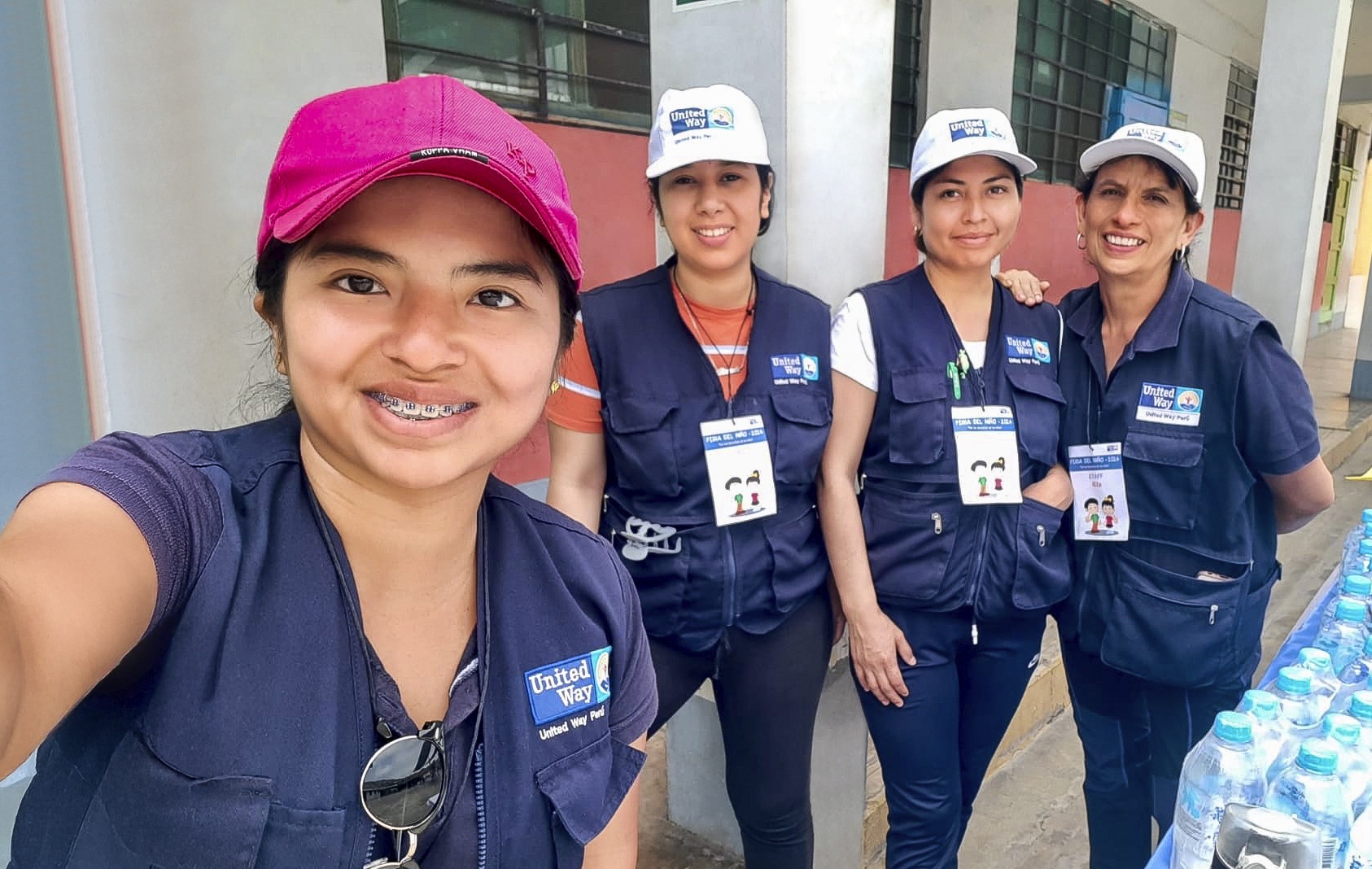 Two people working outside celebrate